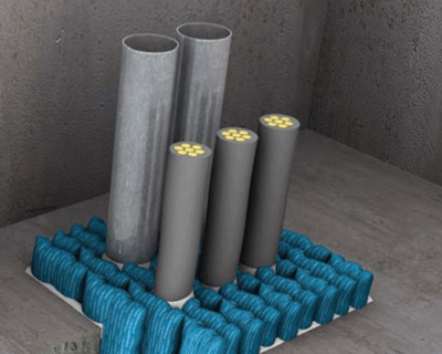 Illustration of Promat Fire Pillows installed on the floor for fire sealing around cables (service penetration).