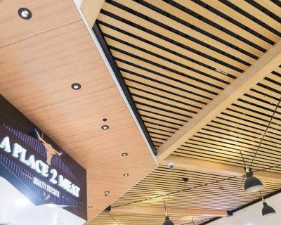 Timber ceiling fit out in shopping centre, using timber battens Austratus Flat Panel Profile